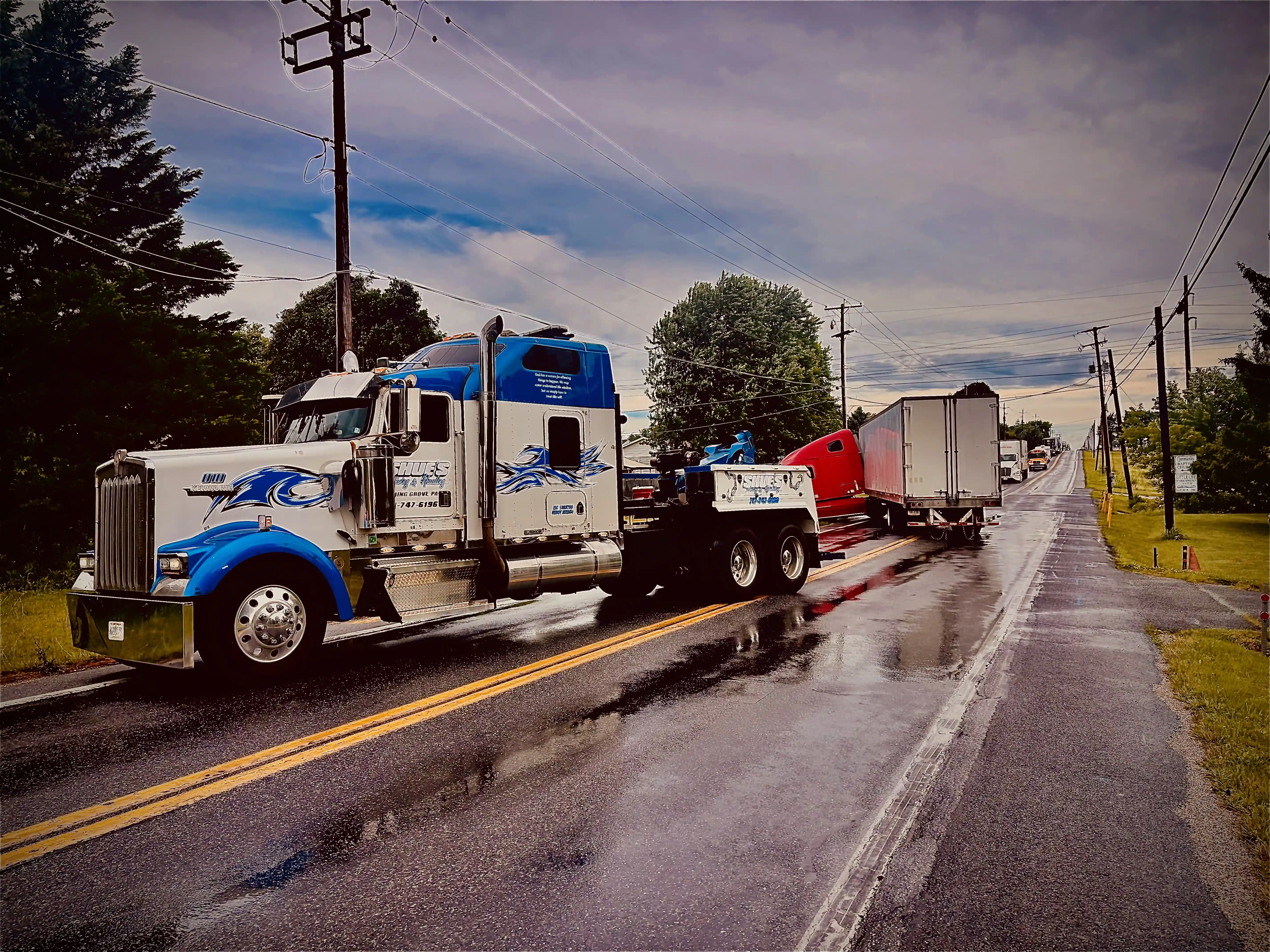 Shues Towing truck recovering a heavy duty semi truck